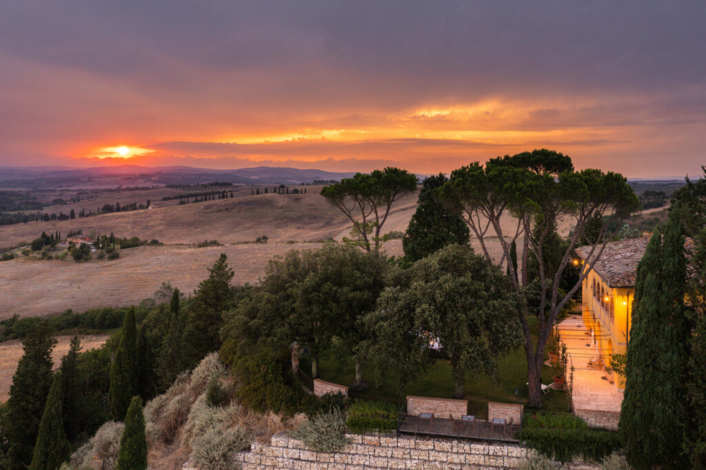 Villa MonteLandi glowing in the warm hues of a Tuscan sunset.